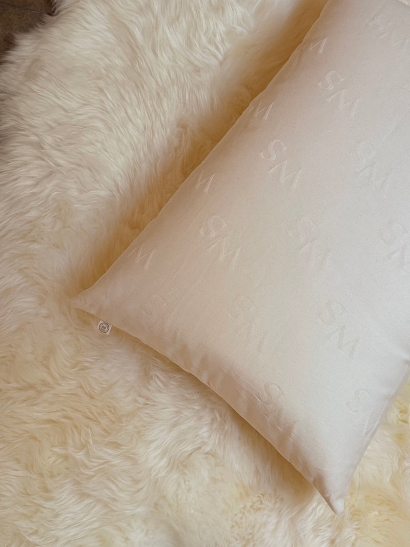 Handmade wool pillow with organic cotton cover by The Woolshire